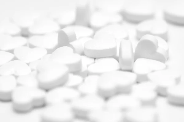 White pills on white background — Stock Photo, Image