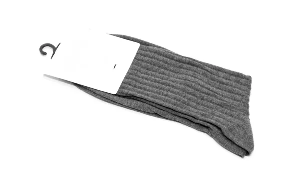 Grijze sokken op een witte achtergrond — Stockfoto