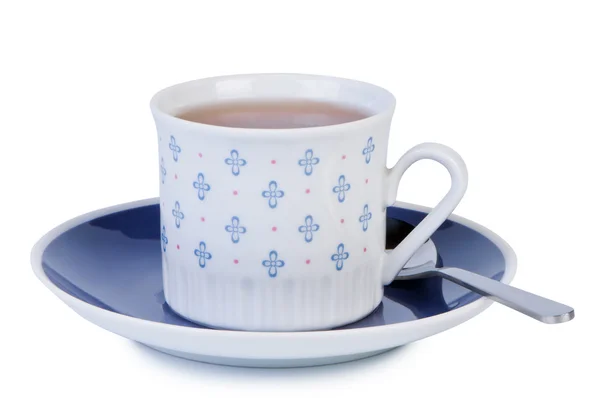 Uçan daire beyaz zemin üzerine izole kaşık ile fincan çay. — Stok fotoğraf