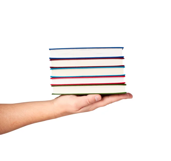 Böcker om hand isolerad på vit bakgrund. — Stockfoto