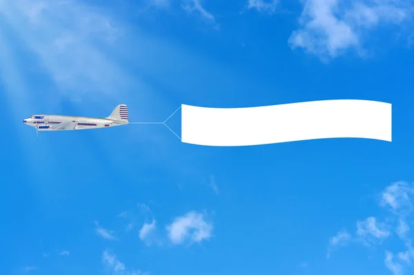 stock image Flying airplane and banner on sky background.