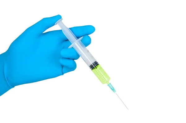Hand in blue rubber glove holds syringe isolated. — Stockfoto