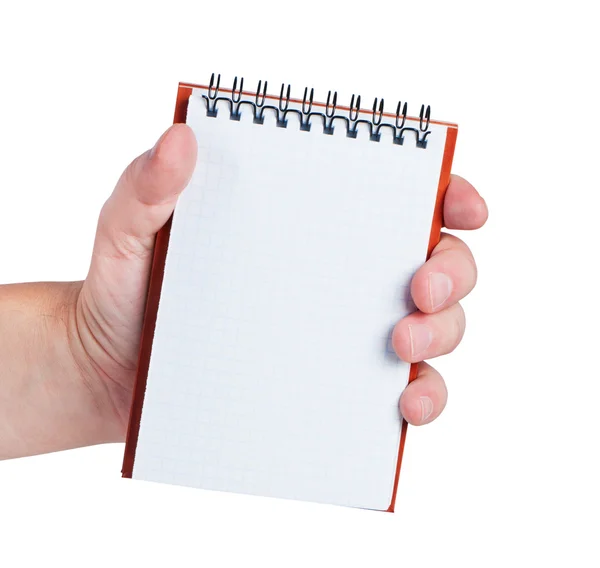 Hand holds notebook isolated on white background. — Stockfoto
