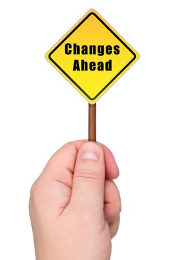 Road sign in hand changes ahead. clipart