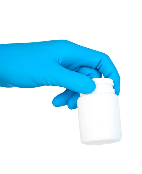 Hand in rubber glove holding jar with medication. — Stock Photo, Image