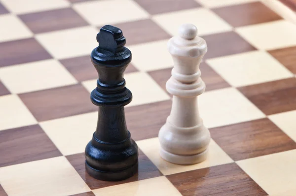 stock image Figures on the chess board, kings and queen.