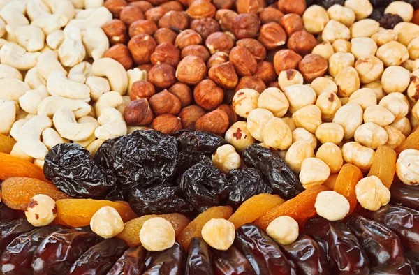 Dried fruits food background with hazel, cashew nuts, prunes, fi — Stock Photo, Image