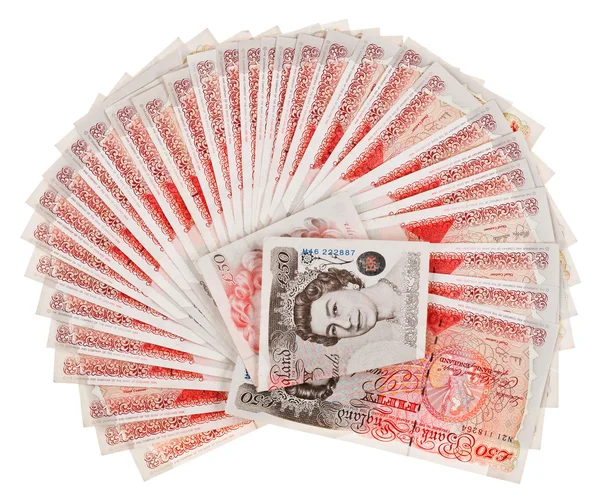Muchos billetes de 50 libras esterlinas se extendieron, aislados en blanco — Foto de Stock