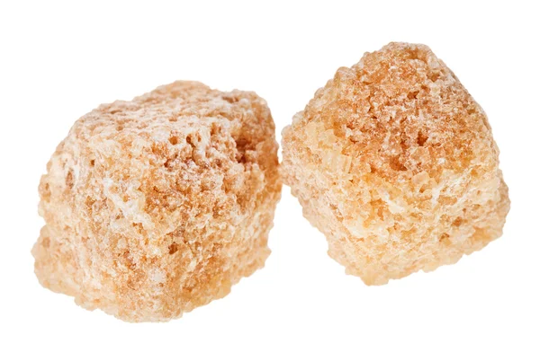 Dois cubos de açúcar de cana-de-açúcar marrom, isolados em branco — Fotografia de Stock