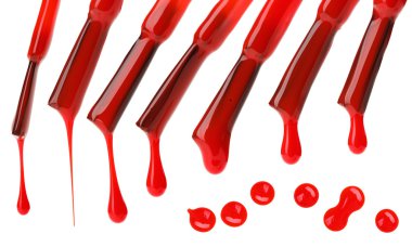 Set of red nail polish brushes and drops isolated on white clipart