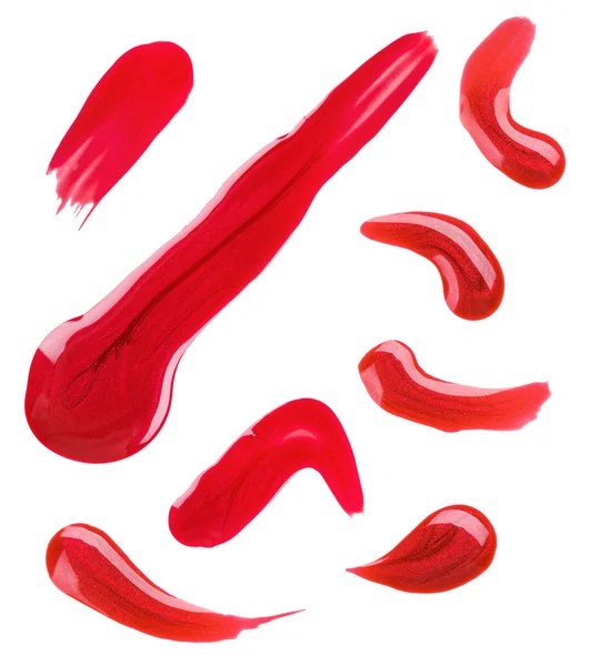 Röda nagellack (emalj) droppar prov, isolerad på vit — Stockfoto