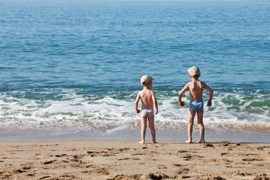 Children on sea beach clipart