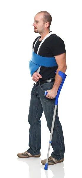 Man with crutch — Stock Photo, Image