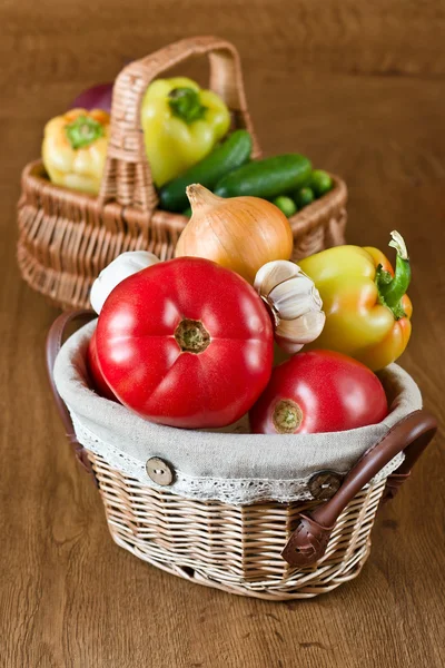Fresh vegetables and tomatoes in baskets — Stock Photo, Image
