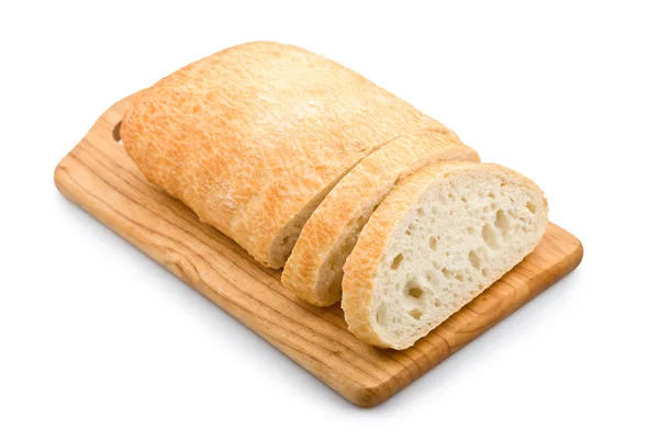 Färskt bröd ciabatta på en planka — Stockfoto