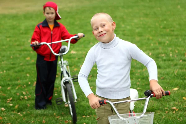 stock image Boy on a bicycle in the green park