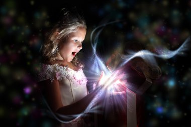 Child opening a magic gift box clipart