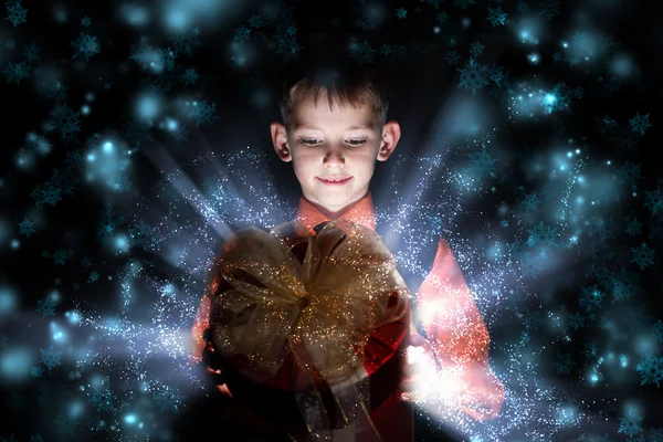 Child opening a magic gift box — Stock Photo, Image