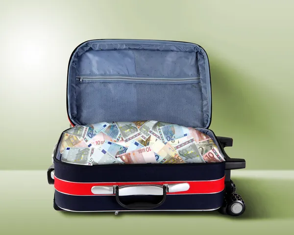 Suitcase full of banknotes — Stock Photo, Image