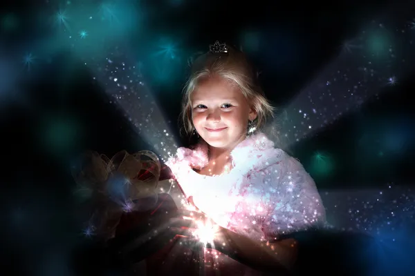 Child opening a magic gift box — Stock Photo, Image
