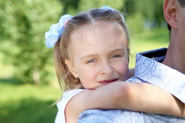 Father and daughter in the summer park