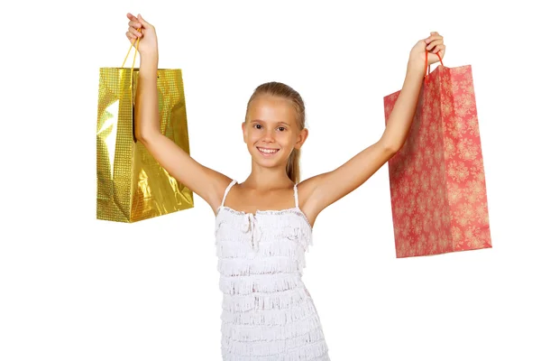 Vrij tienermeisje met shopping tassen — Stockfoto