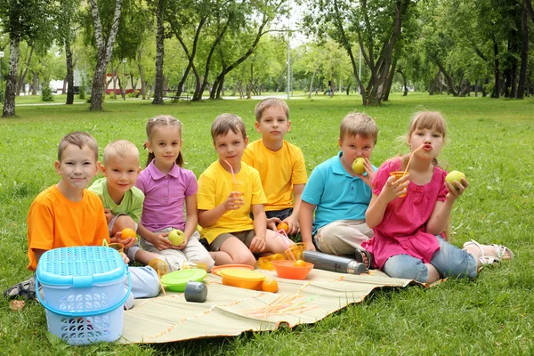 stock image Group of children sitting together in the park