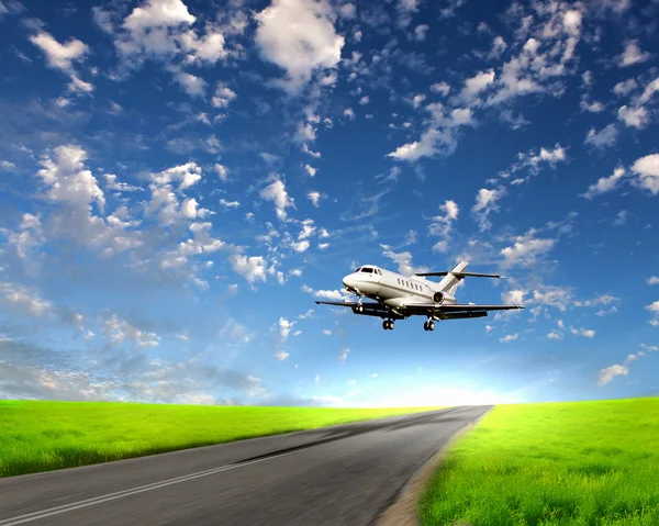 Airplane in blue cloudy sky — Stock Photo, Image
