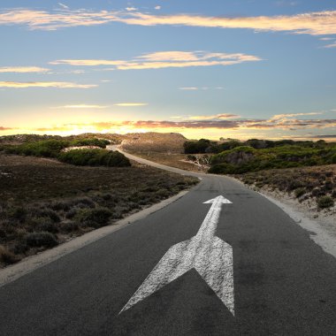 Empty countryside road with white arrow clipart