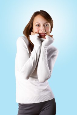 Young girl in white sweater