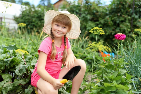 Girl gardening in the summer — Stock Photo, Image