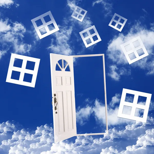 White door against blue sky background — Stock Photo, Image