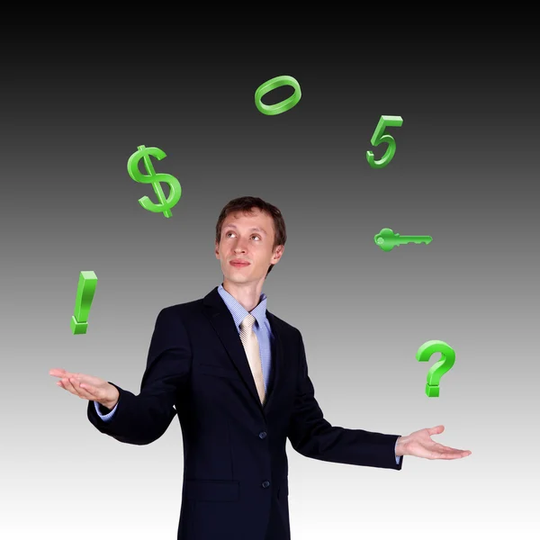 Geschäftsmann jongliert mit Zahlen und Symbolen — Stockfoto