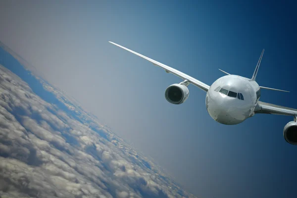 Repülőgép a felhők felett — Stock Fotó
