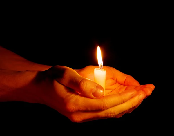 Svíčka v ruce — Stock fotografie