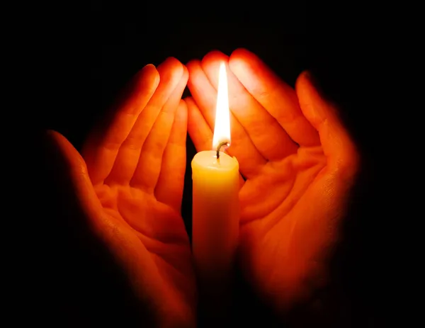 Candle in a hand — Stock Photo, Image
