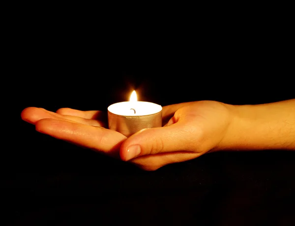 Candle in a hand — Stock Photo, Image
