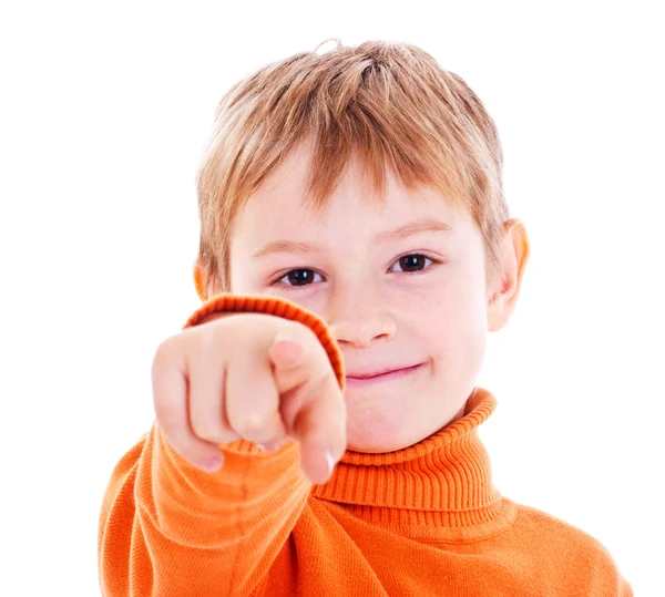 Boy pointing with finger against a white background — Stock Photo, Image