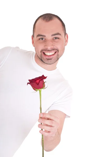 Junger Mann mit Blume in der Hand — Stockfoto