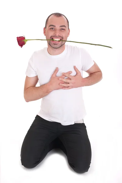 Junger Mann mit einer Rose — Stockfoto