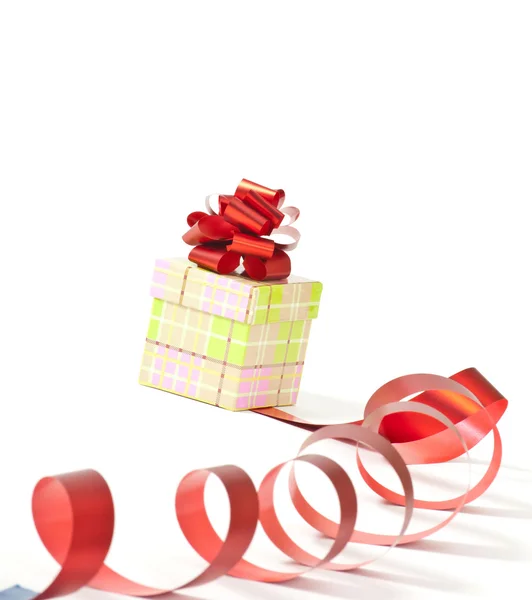 Present box with red ribbon bow isolated on white — Stock Photo, Image