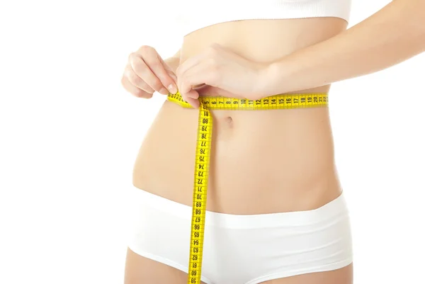 Vrouw lichaamsverzorging en gele maatregel op dijen — Stockfoto