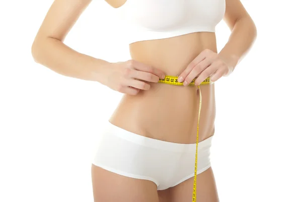 Woman measuring shape of waist — Stock Photo, Image