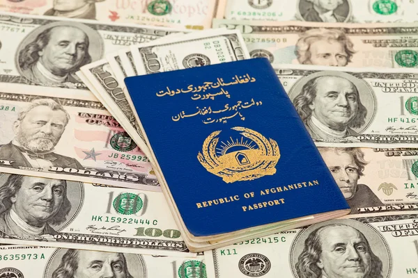 Afgański paszport na nas dolarów tło — Zdjęcie stockowe