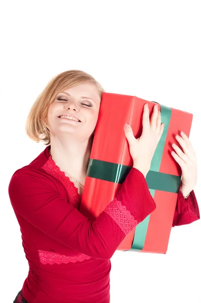 En lykkelig kvinne med julegaver – stockfoto
