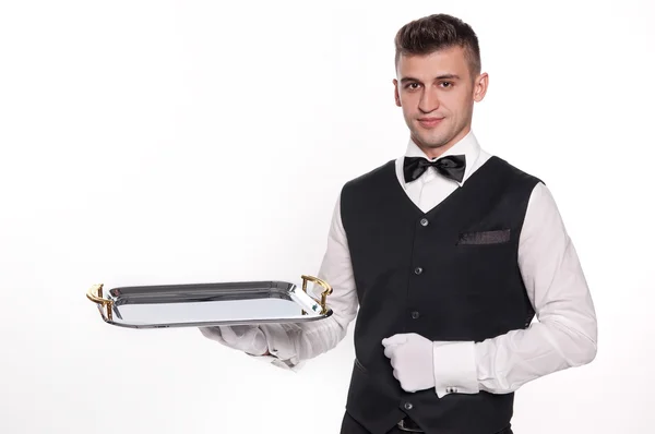 Högdragen servitör innehar ett tomt fack att placera din produkt — Stockfoto