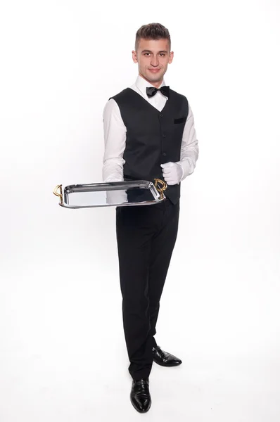 Hochmütiger Kellner, der ein leeres Tablett hält, um sein Produkt abzulegen — Stockfoto