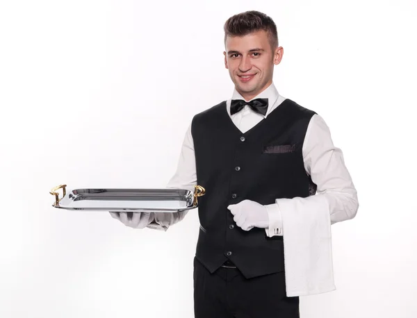 Высокомерный официант держит пустой поднос, чтобы положить ваш продукт — стоковое фото