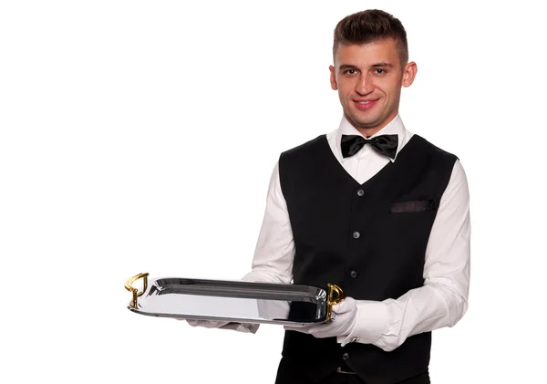 Un giovane cameriere con un vassoio — Foto Stock