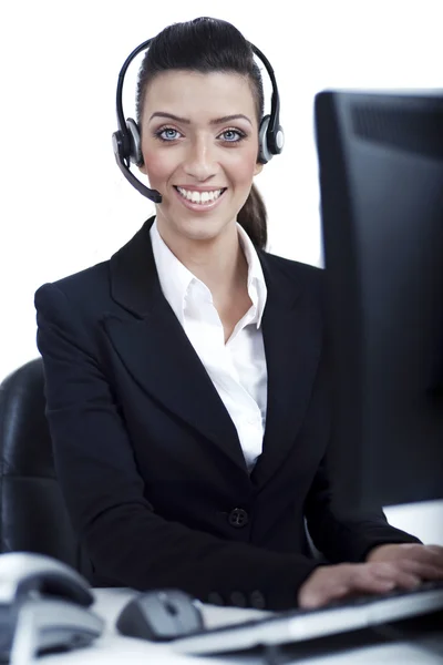 Recepcionista no trabalho com fone de ouvido — Fotografia de Stock